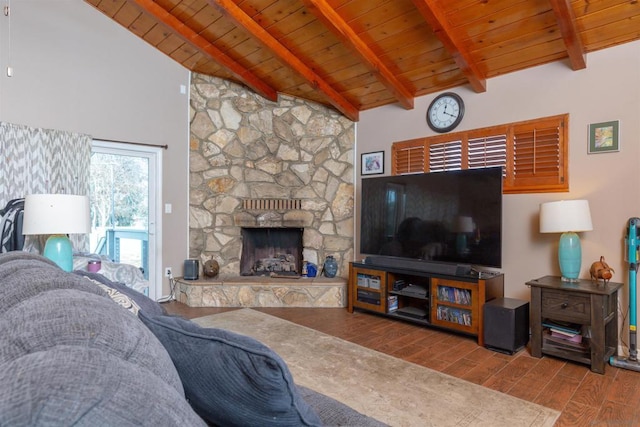 living room featuring high vaulted ceiling, wood ceiling, beamed ceiling, and a stone fireplace