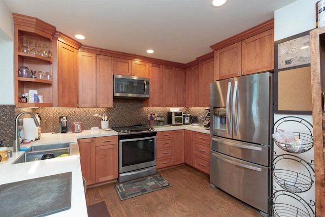 kitchen featuring dark wood-type flooring, sink, appliances with stainless steel finishes, and tasteful backsplash