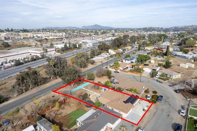 birds eye view of property featuring a mountain view