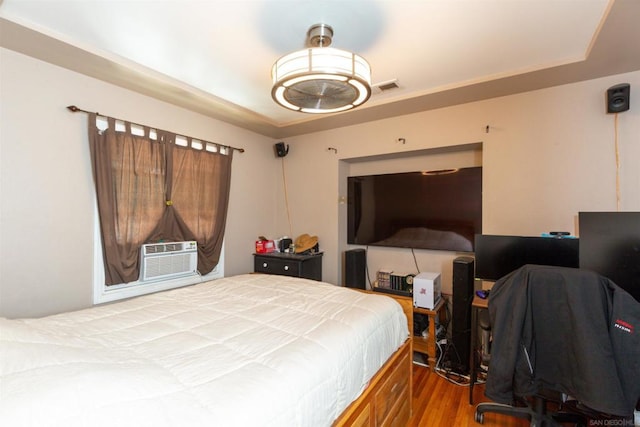 bedroom featuring cooling unit and hardwood / wood-style floors