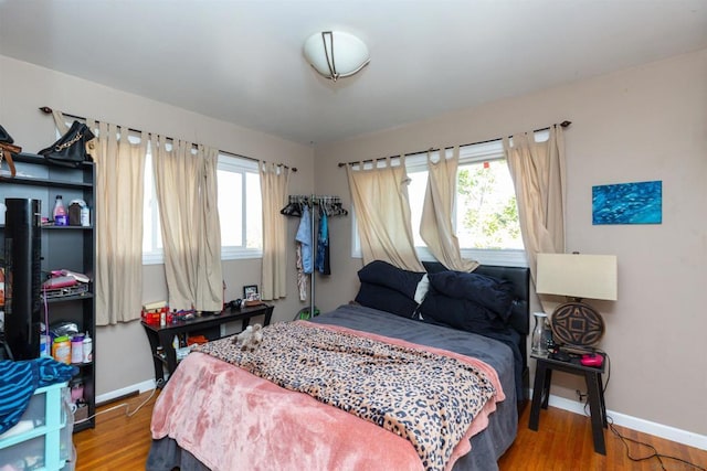 bedroom featuring wood-type flooring