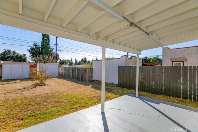 view of patio with a storage unit