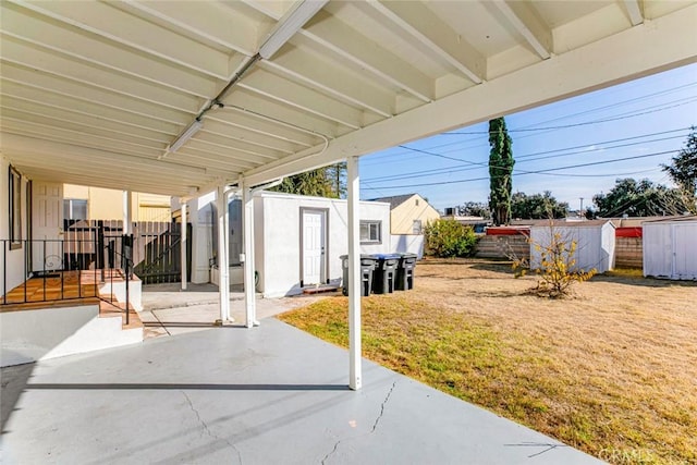 view of patio / terrace with a storage shed