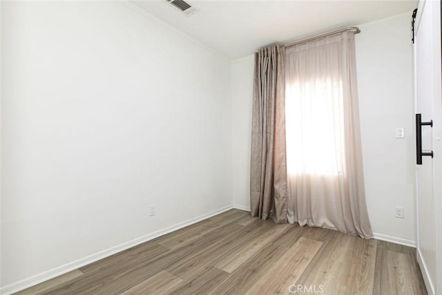 empty room with light wood-type flooring