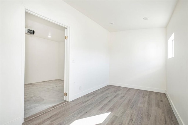 spare room featuring light wood-type flooring