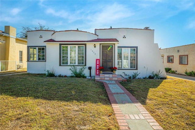 view of front of home with a front lawn