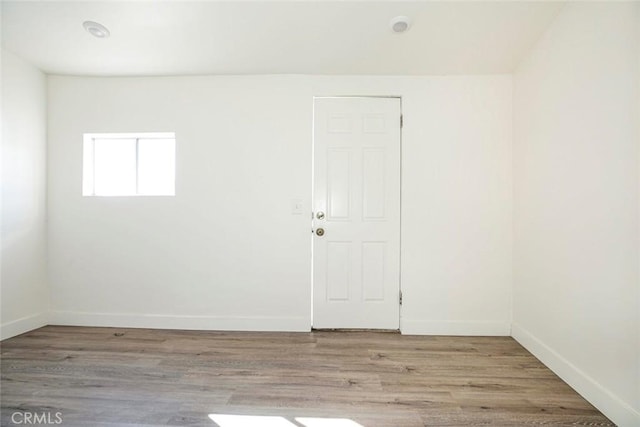 spare room with light hardwood / wood-style flooring