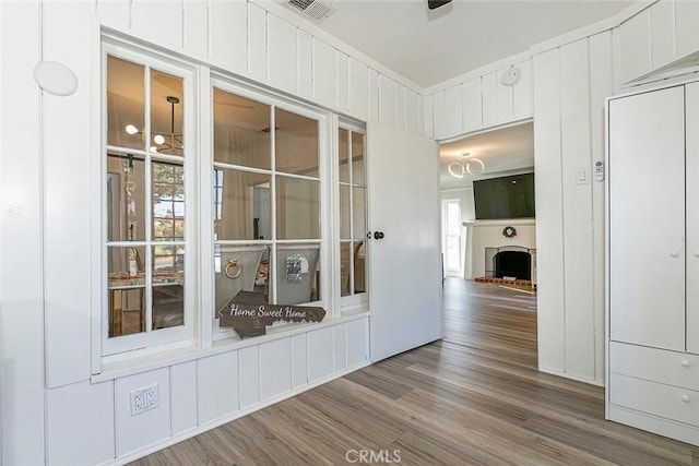 hall with wood-type flooring