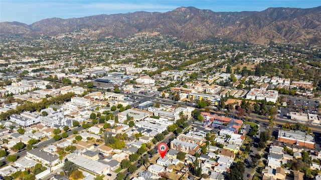 birds eye view of property featuring a mountain view