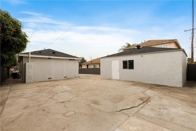 back of property featuring a patio