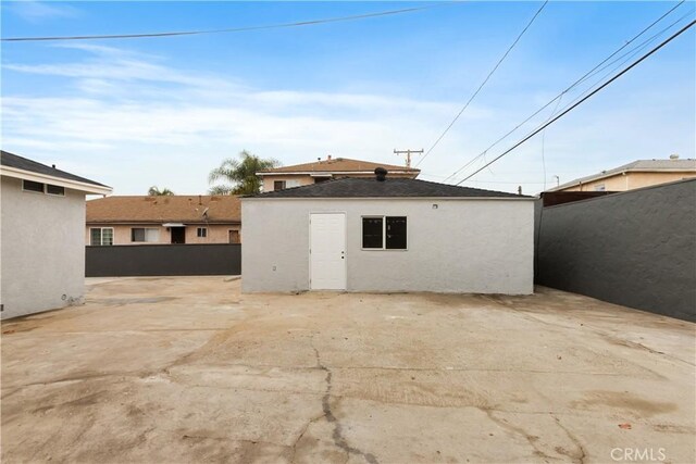 rear view of property featuring a patio area