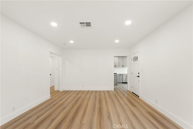 unfurnished room with light hardwood / wood-style floors