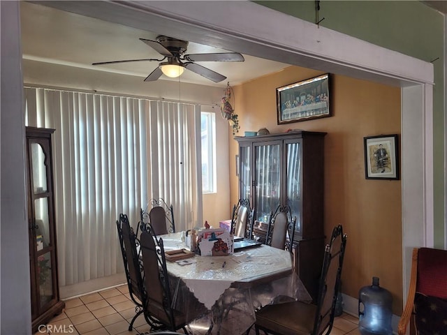 dining room with ceiling fan and light tile patterned floors