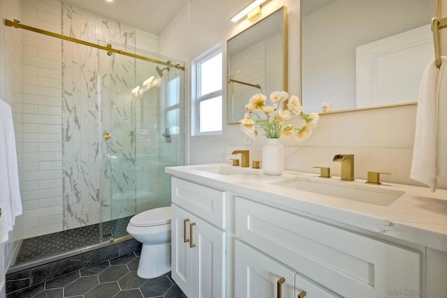 bathroom with walk in shower, vanity, tile patterned floors, and toilet