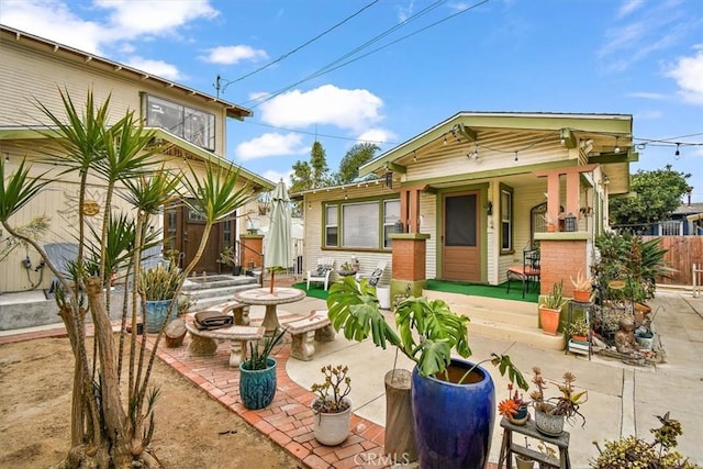 back of house with a patio