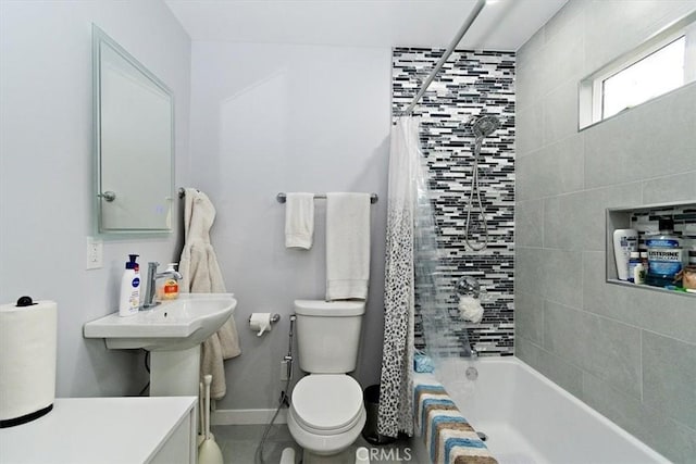 bathroom featuring shower / bath combination with curtain and toilet