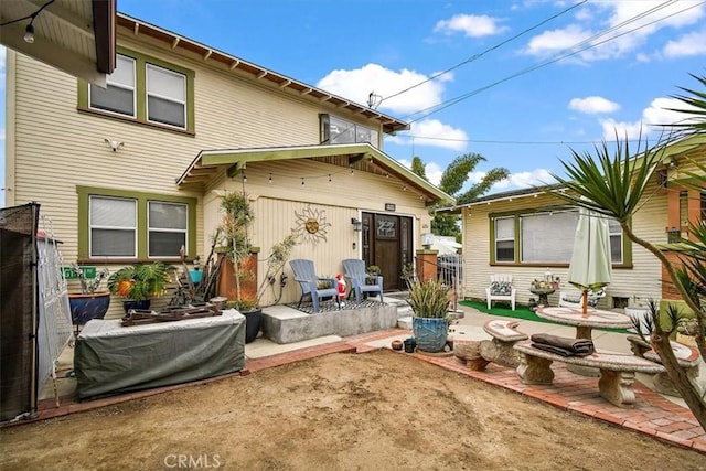 rear view of property with a patio