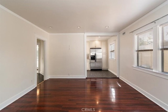 unfurnished room featuring crown molding and dark hardwood / wood-style floors