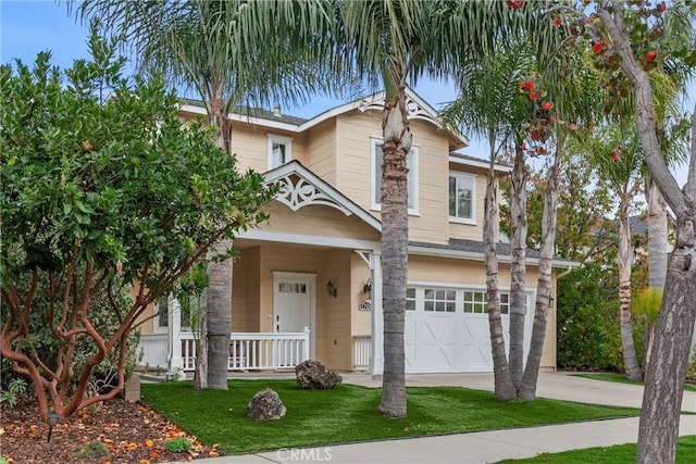 view of front of property with a garage and a porch