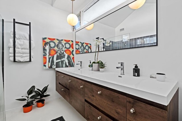 bathroom featuring vanity and vaulted ceiling