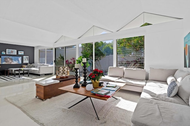 living room featuring vaulted ceiling