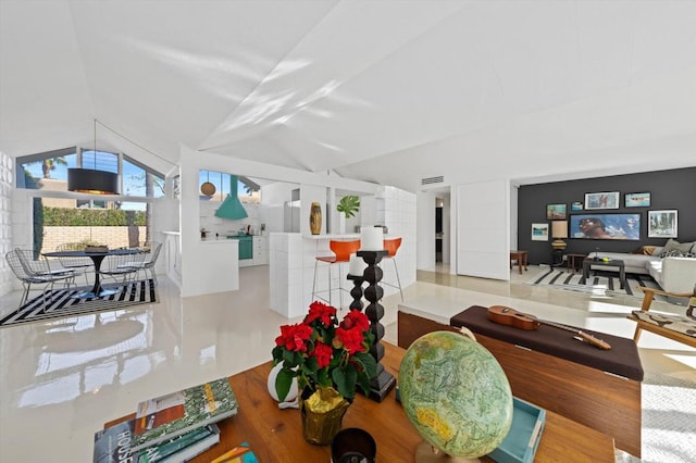 living room with vaulted ceiling and wood-type flooring