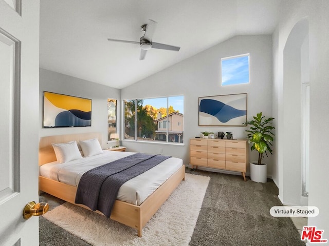 carpeted bedroom featuring ceiling fan and lofted ceiling