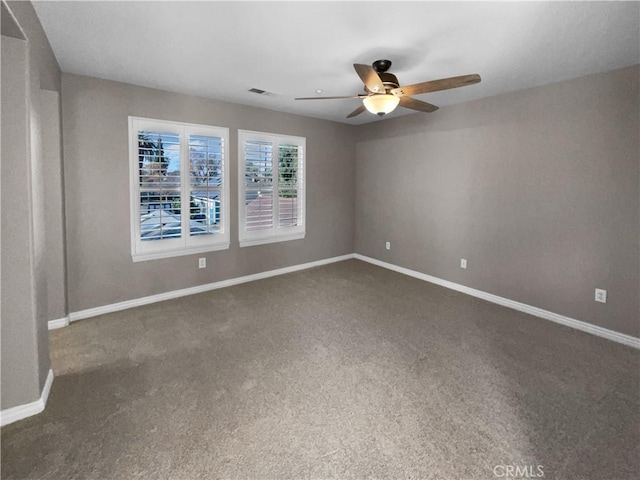 carpeted empty room with ceiling fan