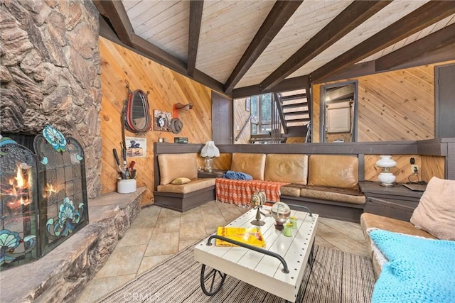 living room featuring wooden ceiling, light tile patterned floors, wooden walls, and vaulted ceiling with beams