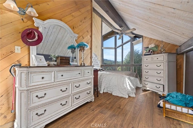 bedroom with wood ceiling, vaulted ceiling with beams, hardwood / wood-style floors, and wooden walls