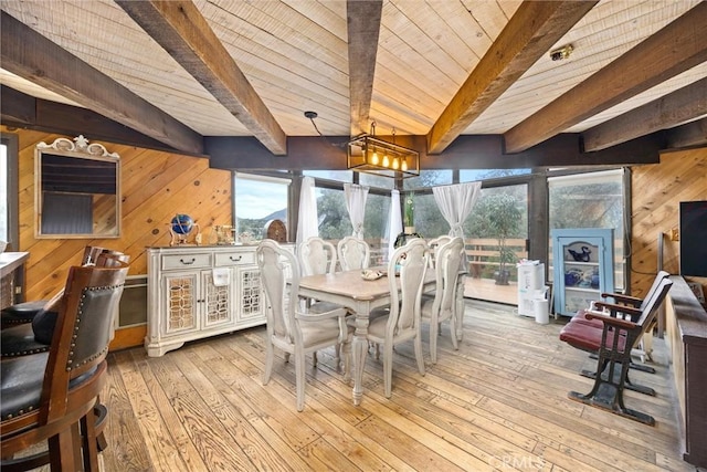 sunroom with an inviting chandelier, wood ceiling, and beamed ceiling