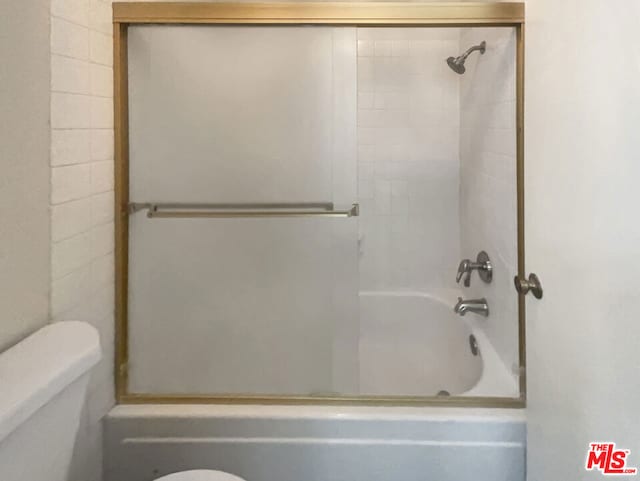 bathroom with shower / bathtub combination and toilet