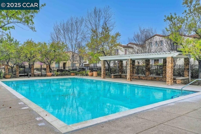 view of swimming pool featuring a pergola