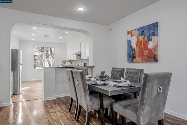 dining area featuring hardwood / wood-style floors