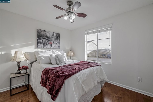 bedroom with ceiling fan and dark hardwood / wood-style floors