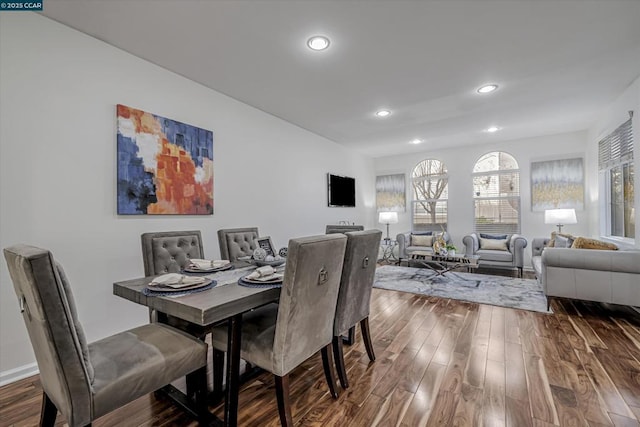 dining space with hardwood / wood-style floors