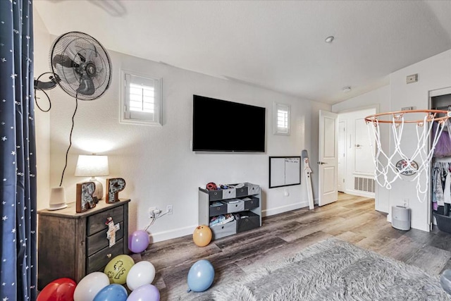 interior space with lofted ceiling and wood-type flooring