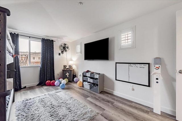 recreation room with hardwood / wood-style flooring