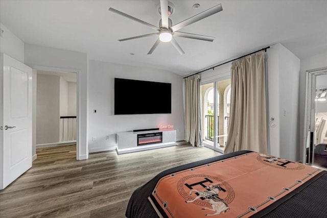 bedroom with ceiling fan, hardwood / wood-style flooring, and access to outside