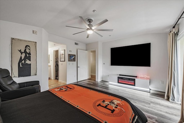 interior space with ceiling fan and hardwood / wood-style flooring