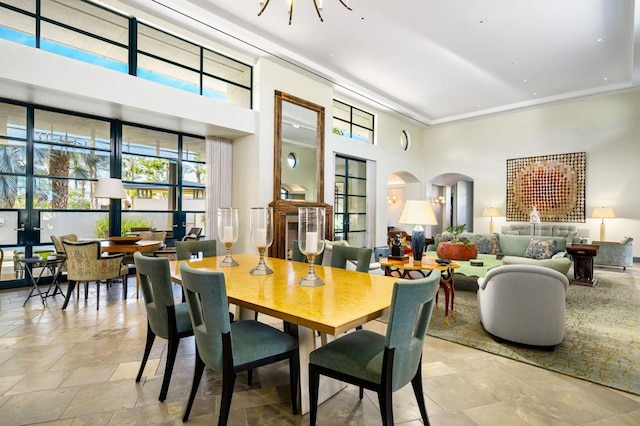 dining room featuring a high ceiling and a notable chandelier