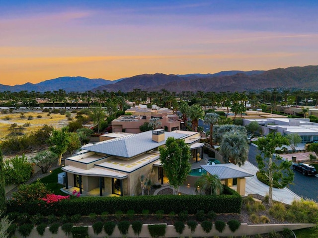 aerial view at dusk with a mountain view