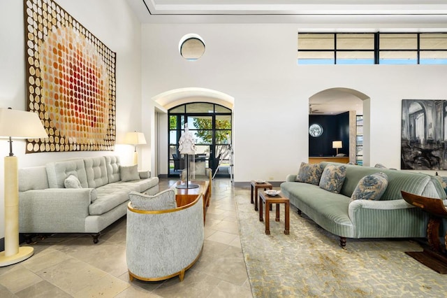 living room with a towering ceiling