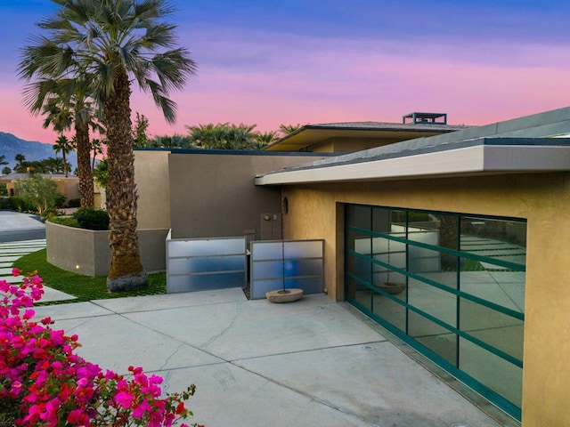 view of patio terrace at dusk