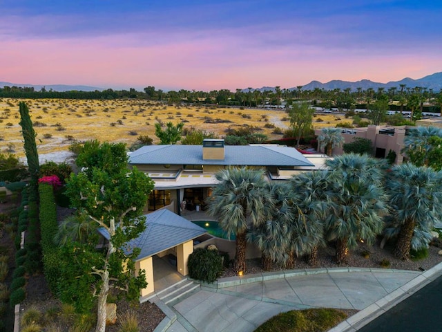 aerial view at dusk with a mountain view