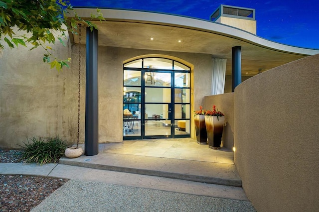 doorway to property featuring french doors