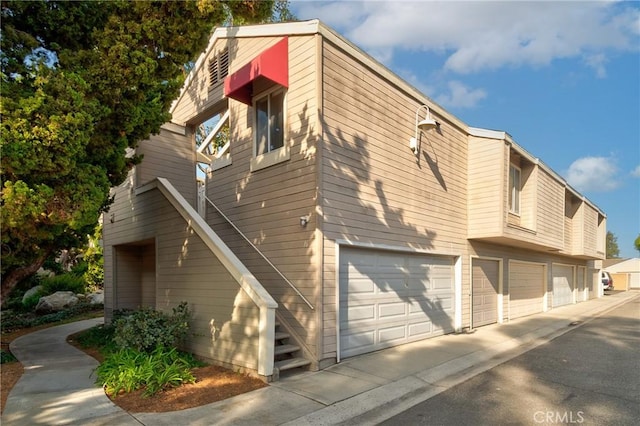 view of property exterior featuring a garage