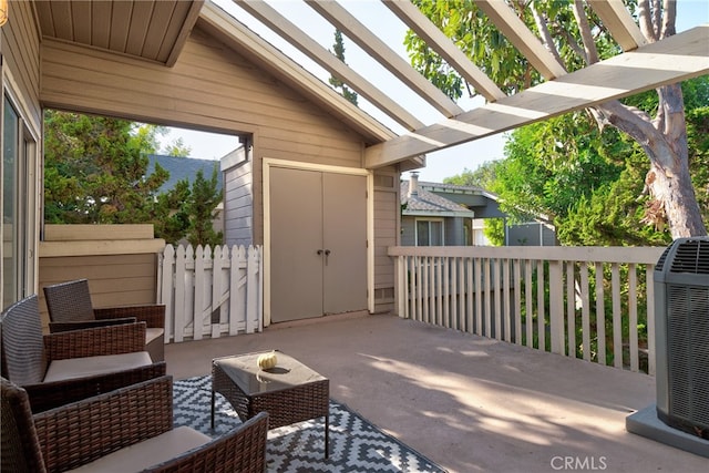 view of patio / terrace featuring cooling unit, an outdoor hangout area, and a pergola