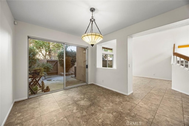 unfurnished dining area featuring tile patterned floors