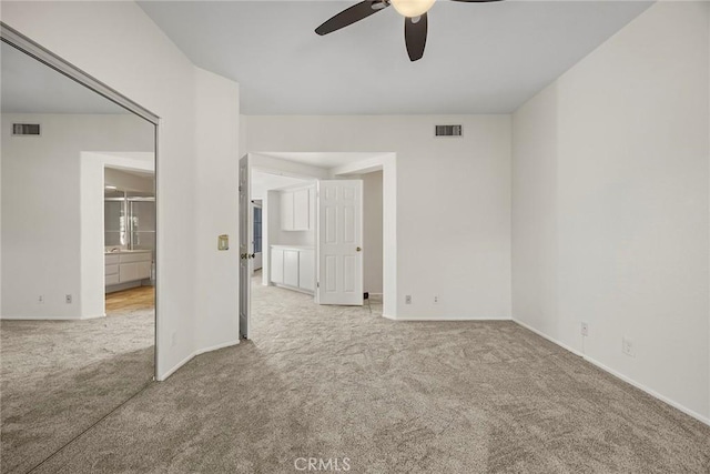 carpeted empty room with ceiling fan